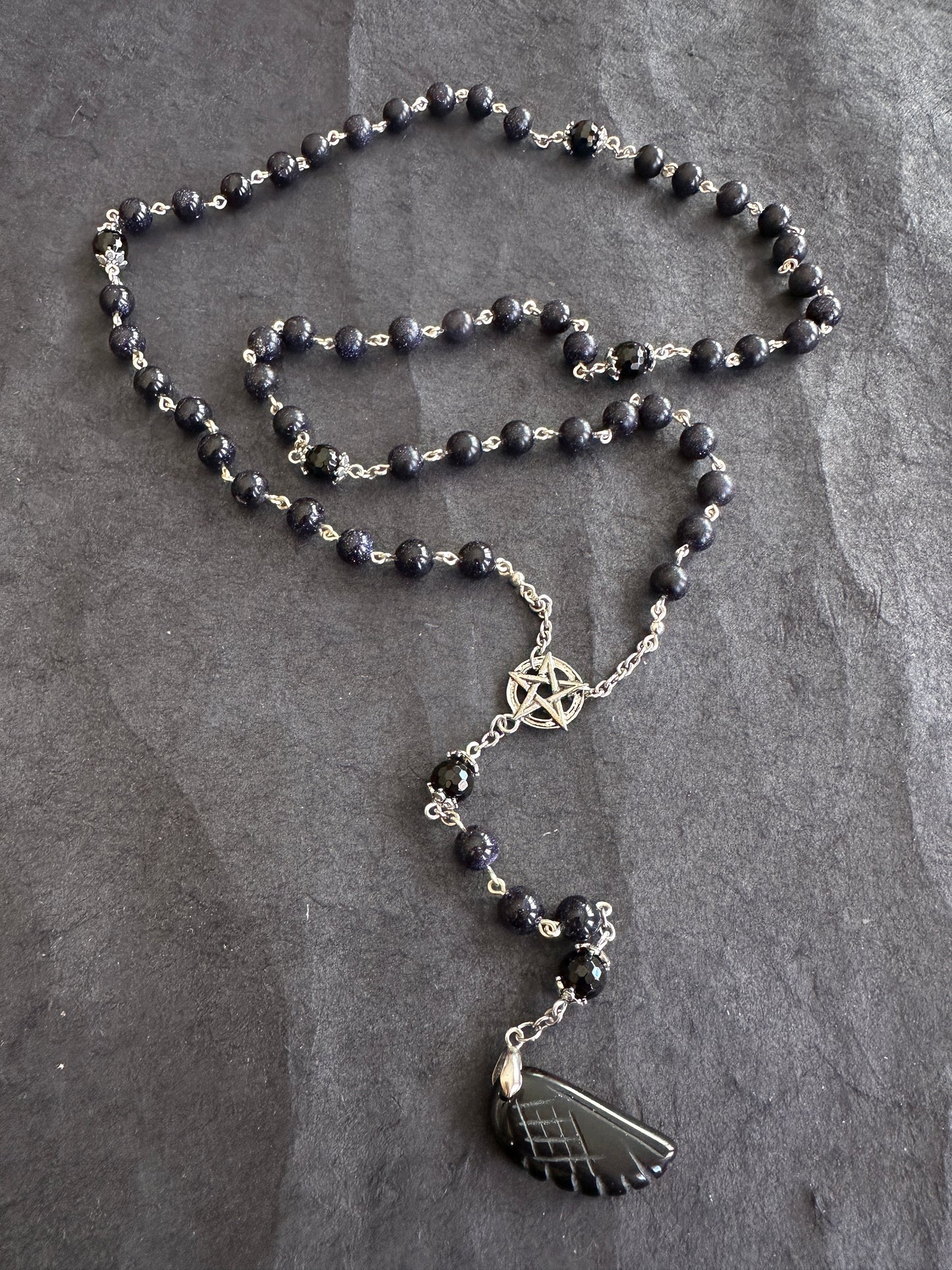 Blue goldstone rosary with black onyx pendant