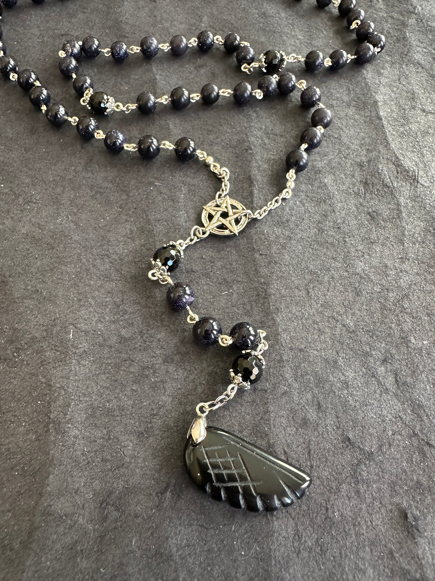 Blue goldstone rosary with black onyx pendant
