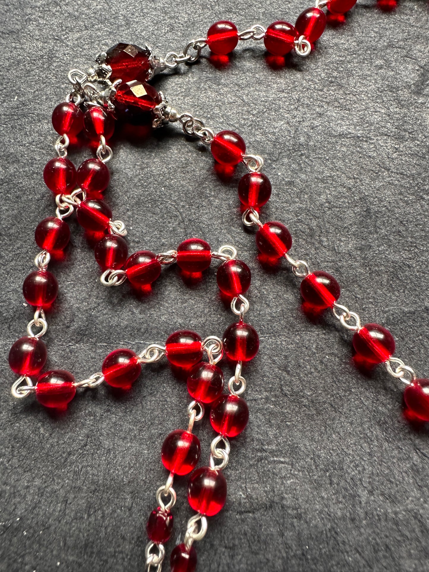 Red glass cross unholy rosary