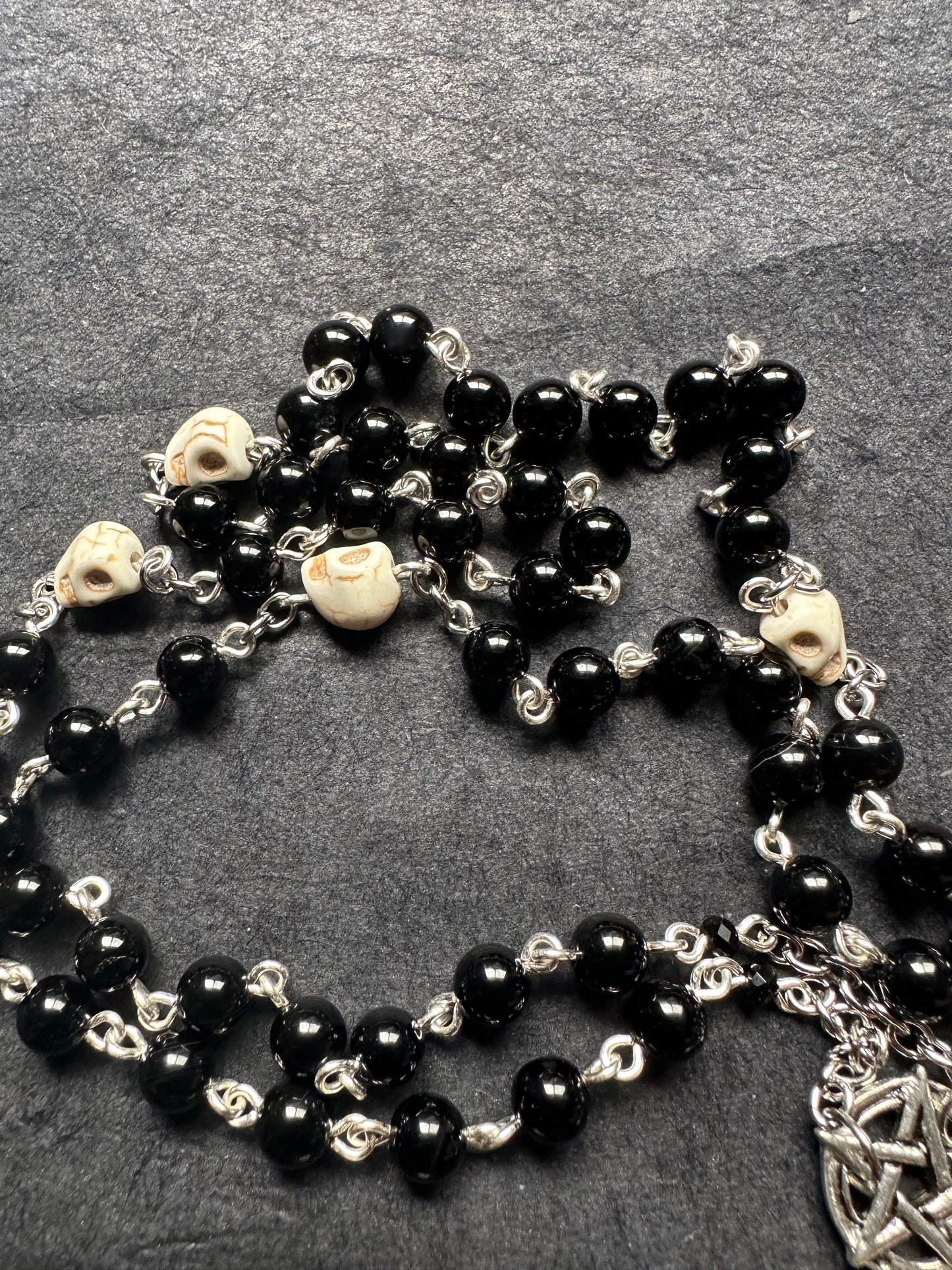 Black onyx rosary with Guinea pig paw and skull beads