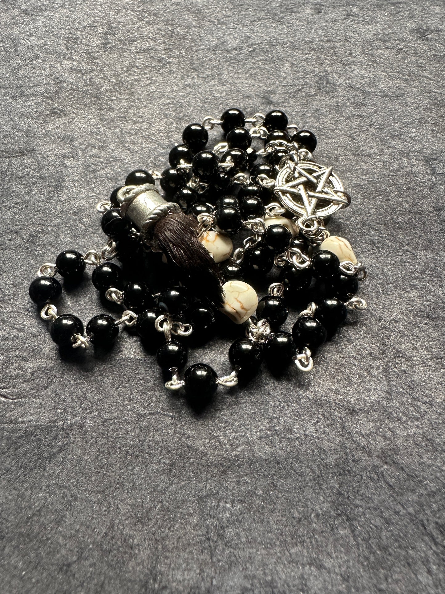 Black onyx rosary with Guinea pig paw and skull beads