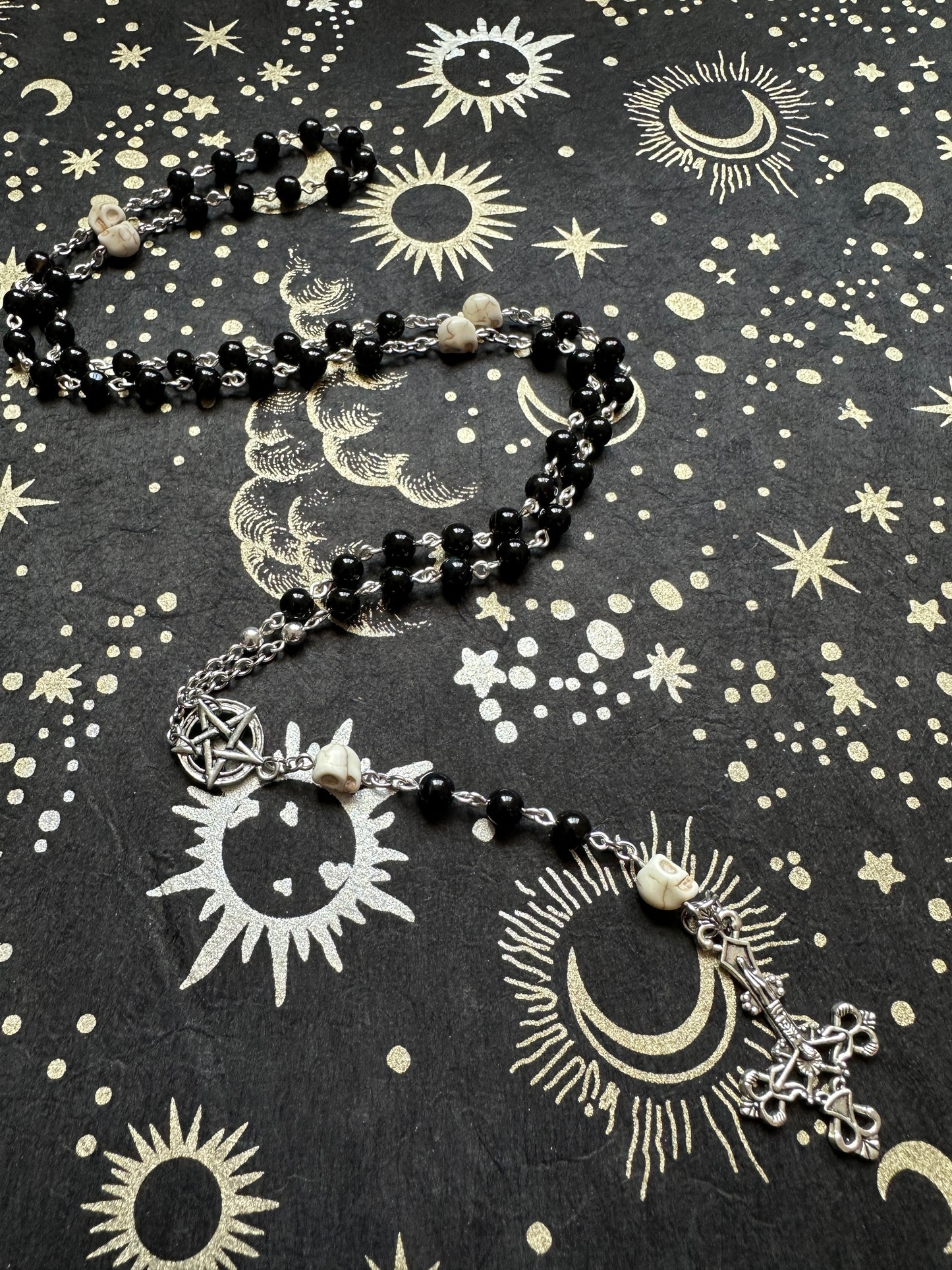 Black rosary with skull beads