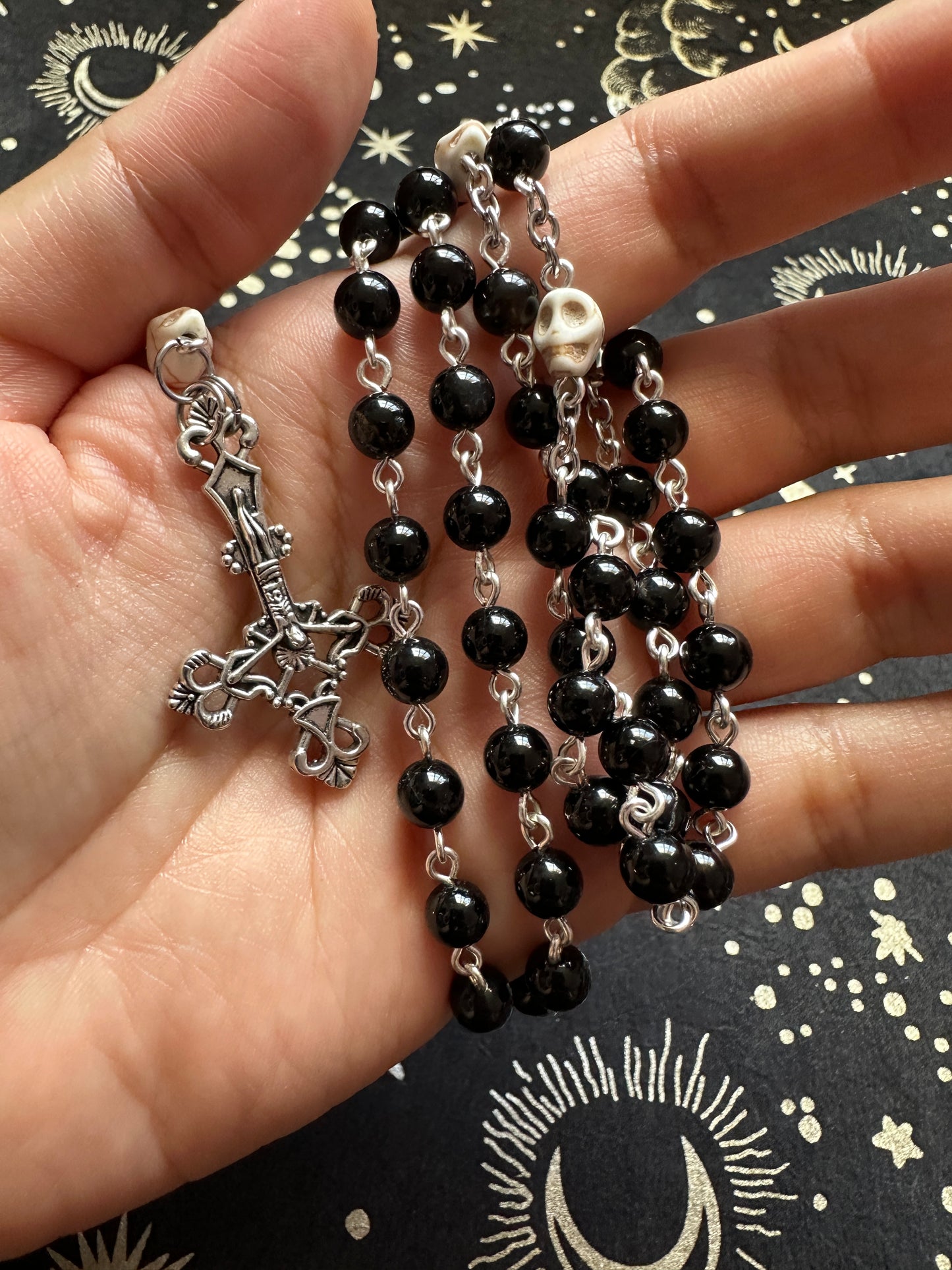 Black rosary with skull beads