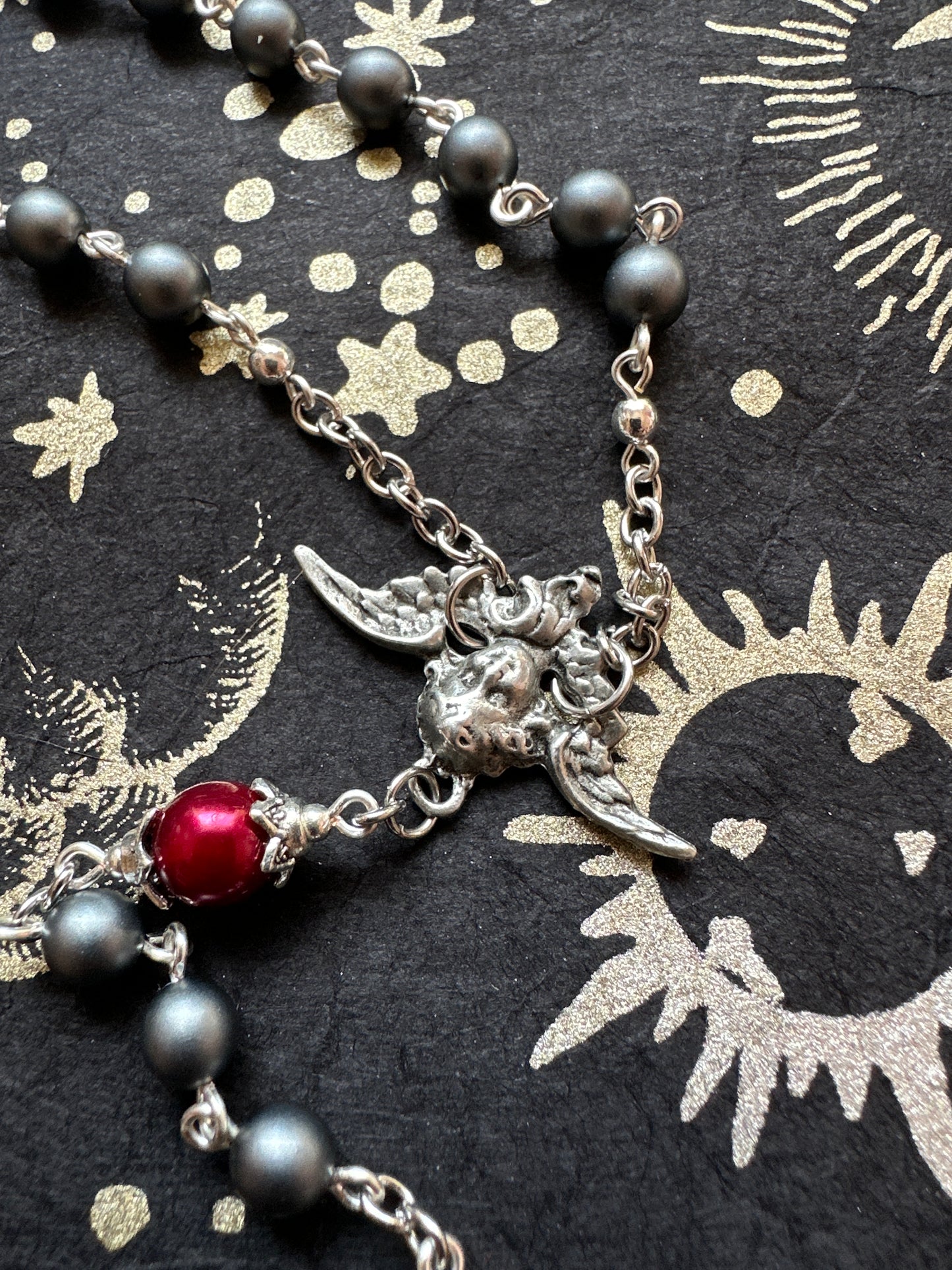 Fallen Angel rosary with snake pendant