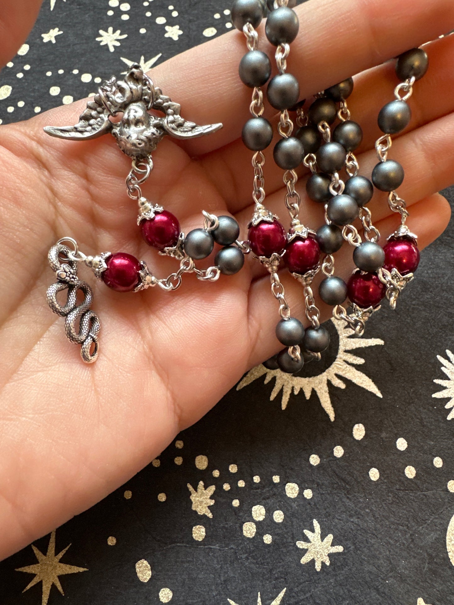 Fallen Angel rosary with snake pendant