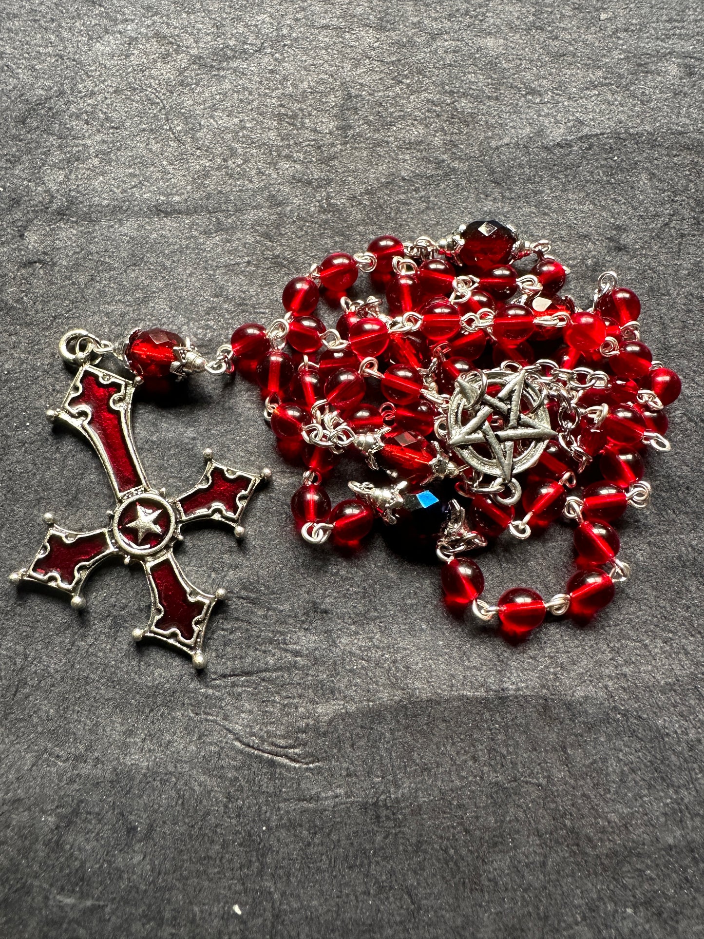 Red glass cross unholy rosary