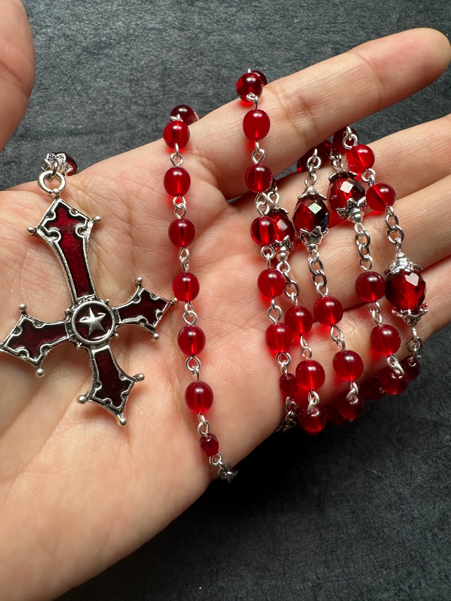 Red glass cross unholy rosary