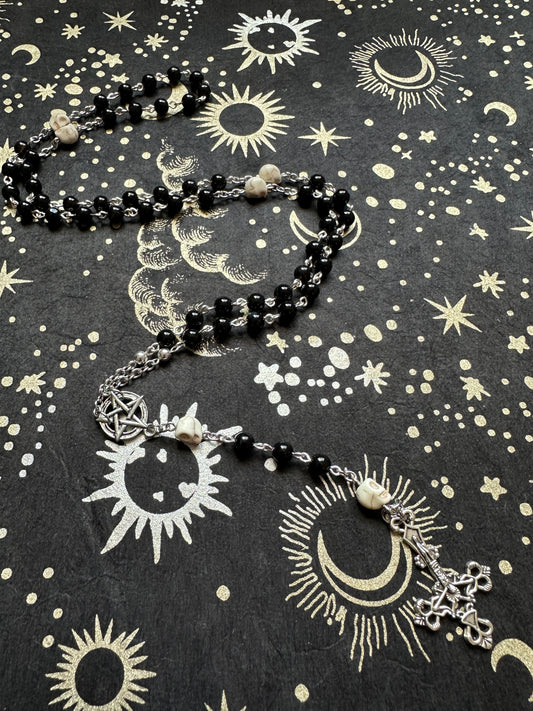 Black rosary with skull beads