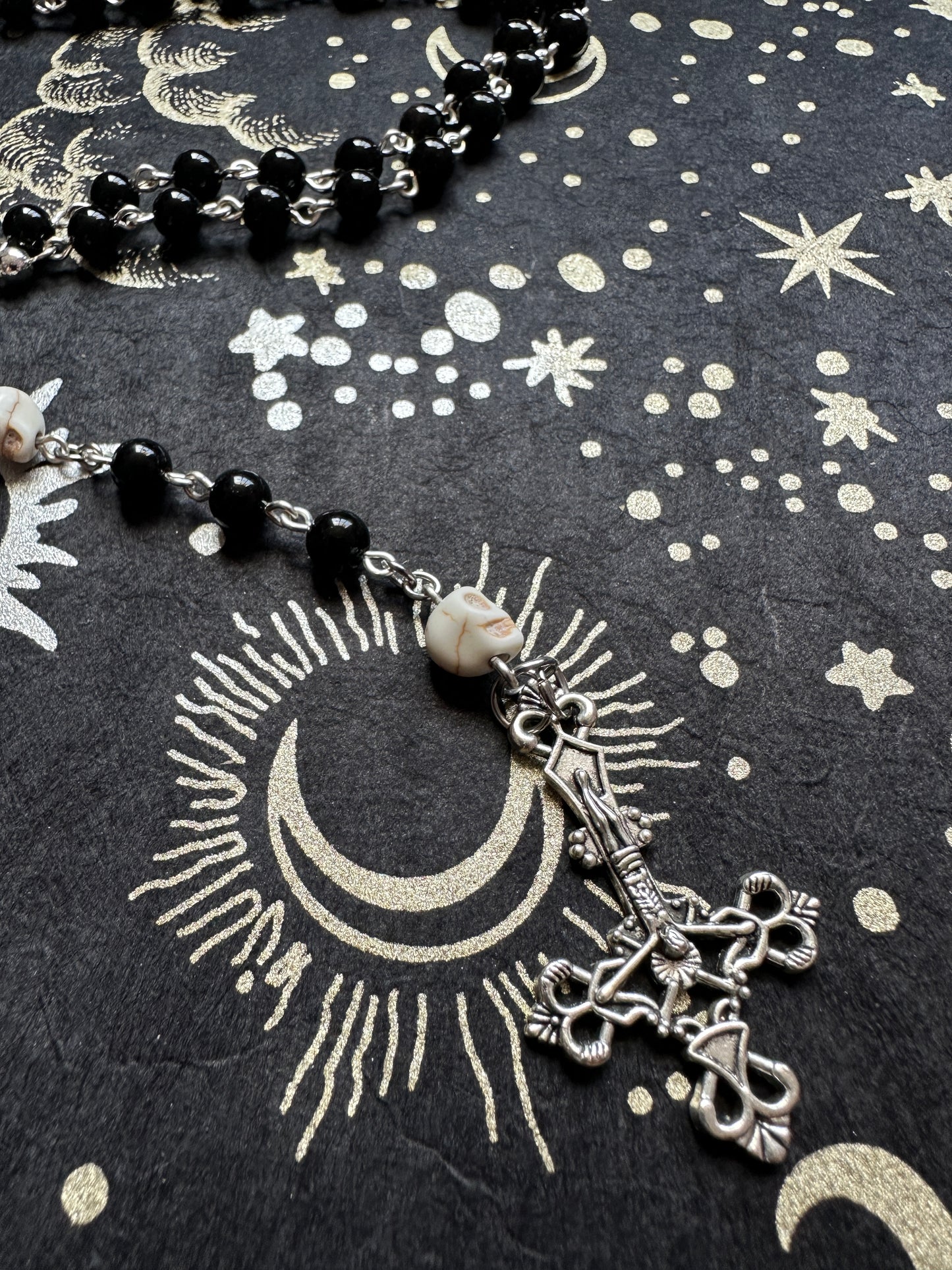 Black rosary with skull beads